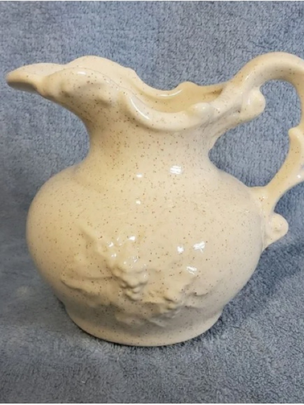 Speckled Cream Ceramic Pitcher with Scrolled Handle